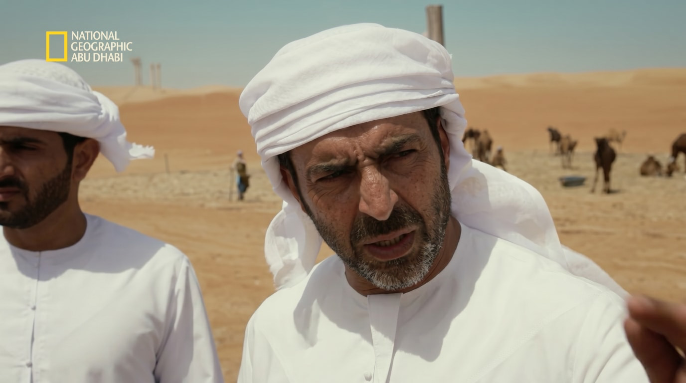 Emirati expedition lead standing in the desert during the Land Rover Tropic of Cancer journey.